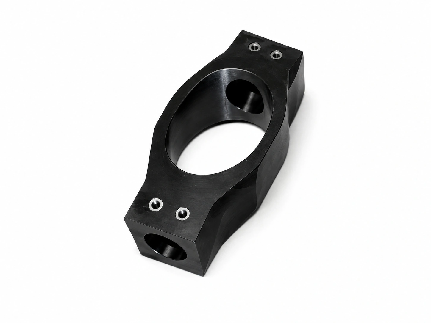 Precision-machined black steel bearing housing bracket with a large central bore and multiple mounting holes on a white background.